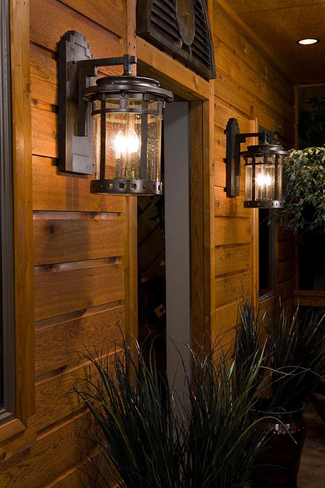 hacienda style iron lamp from Mexico iluminating exterior of the house