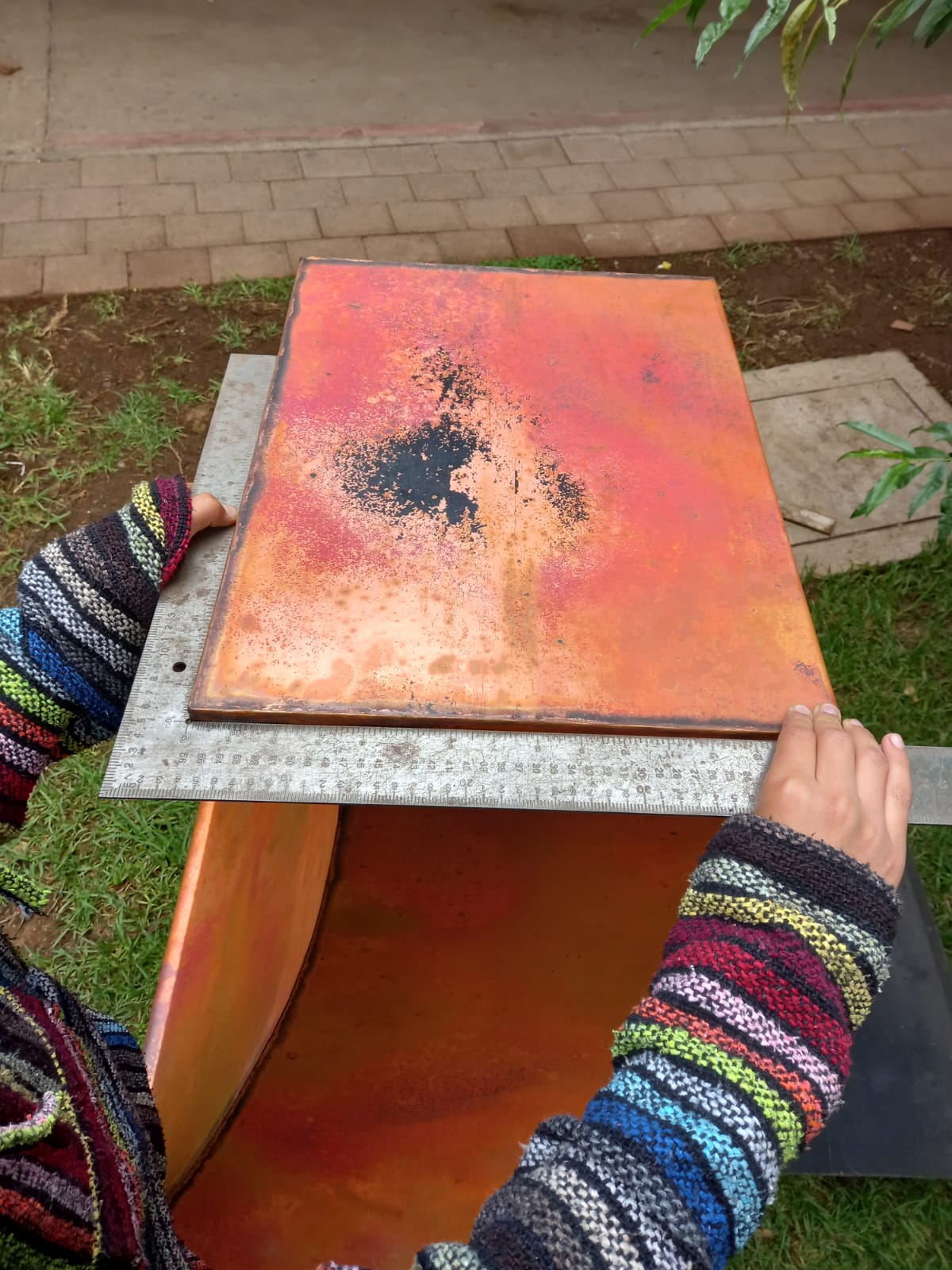 A wall mount copper vent hood in a kitchen