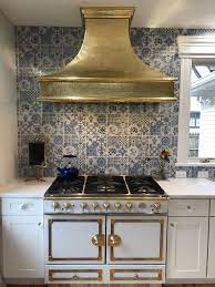 handmade to order brass kitchen range hood over the island