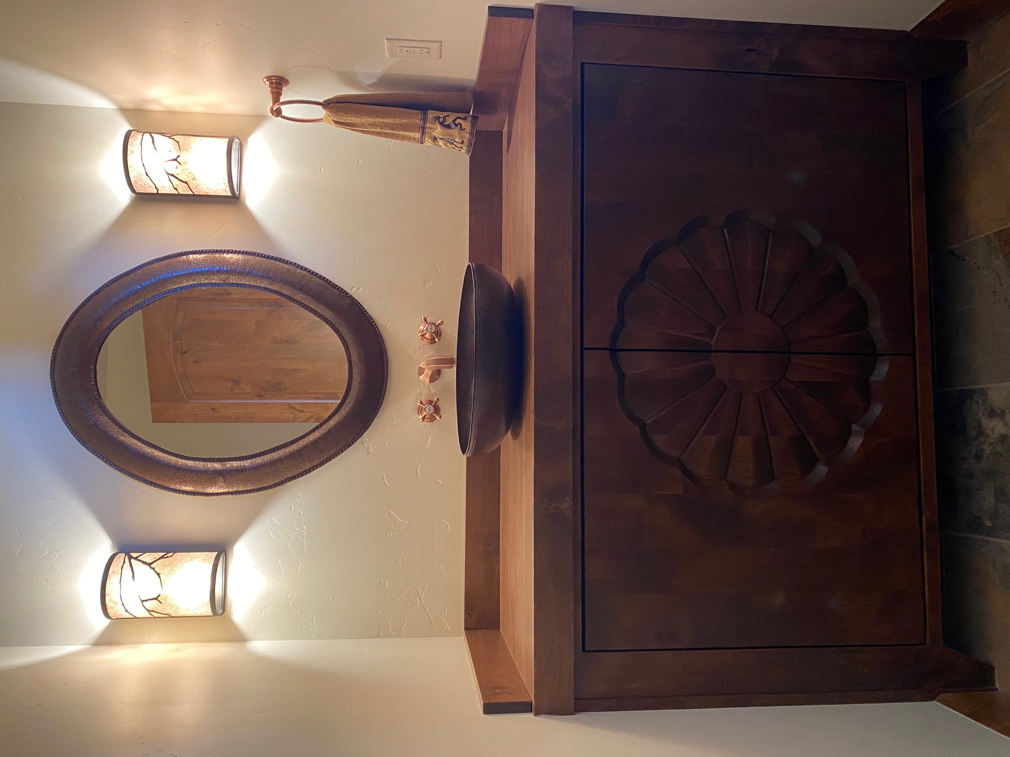 copper mirror frame decorating a living room wall