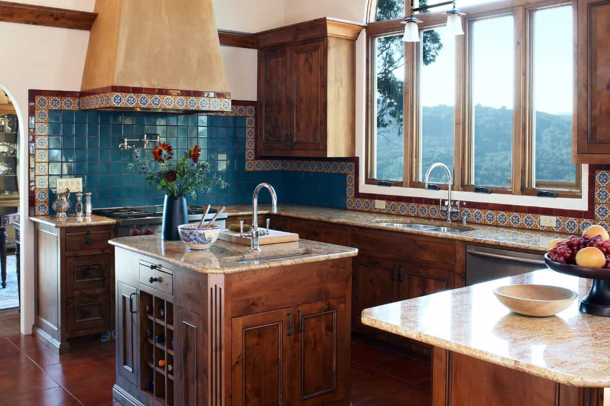 hand painted ceramic tiles decorating a kitchen wall