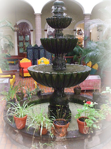 mexican stone fountain in a garden